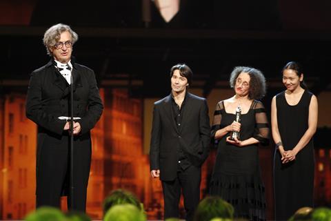 Wim Wenders on stage with some of the dancers who appear in Pina